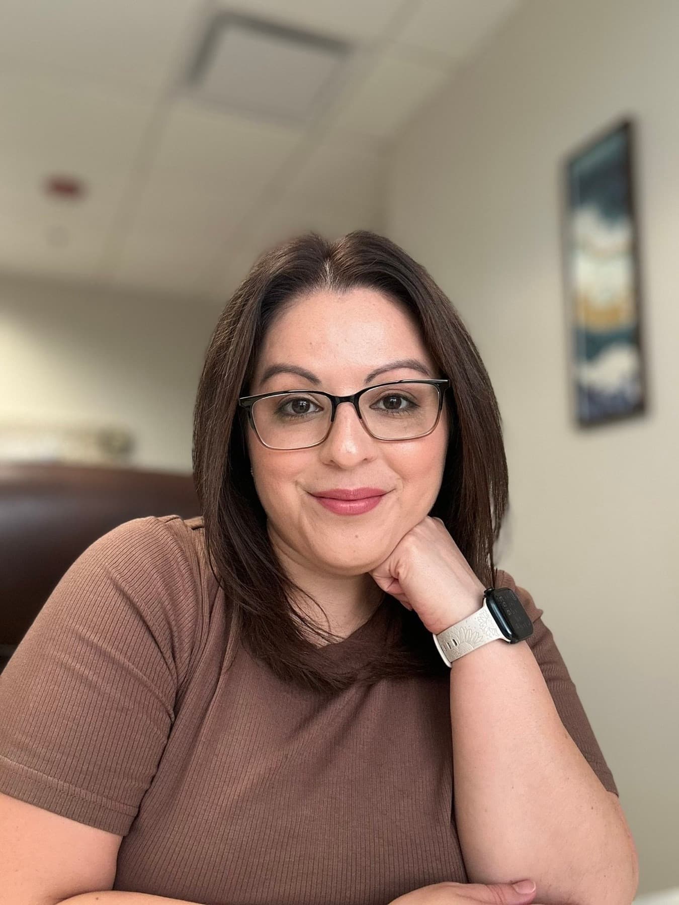 Becky Romero, LMHC, at her desk