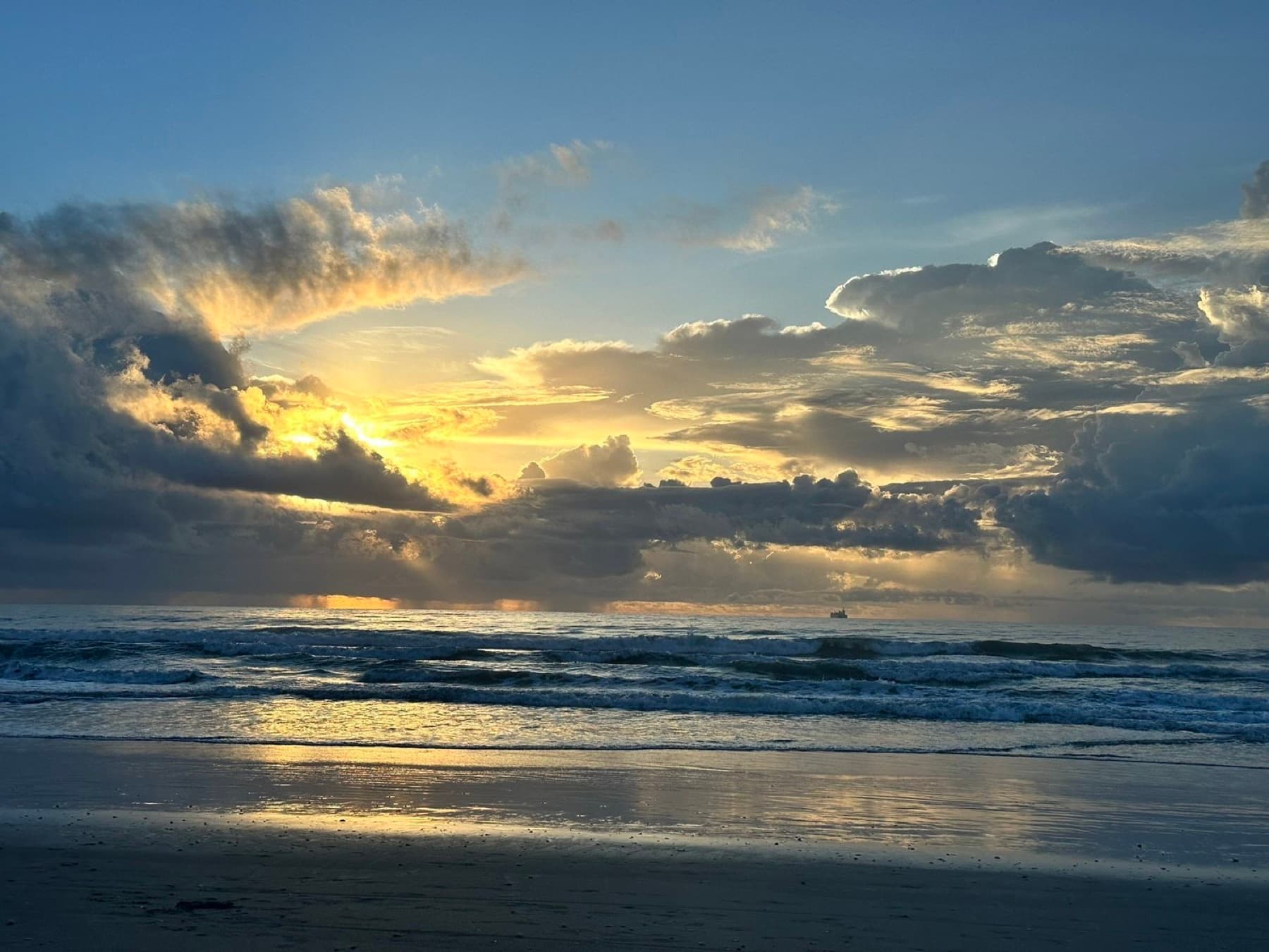 Sunrise breaking through clouds over the ocean, for clients in West Palm Beach, Florida